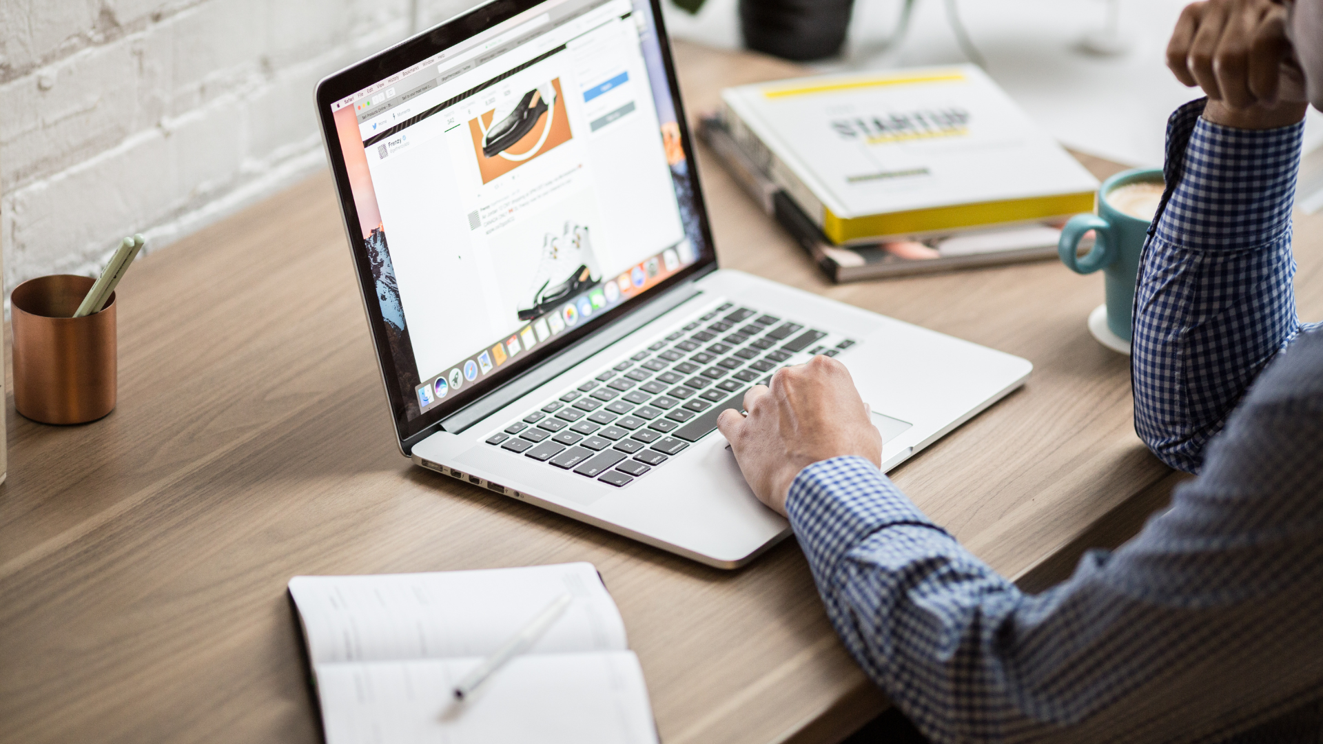 Man using a laptop to audit his website for UX